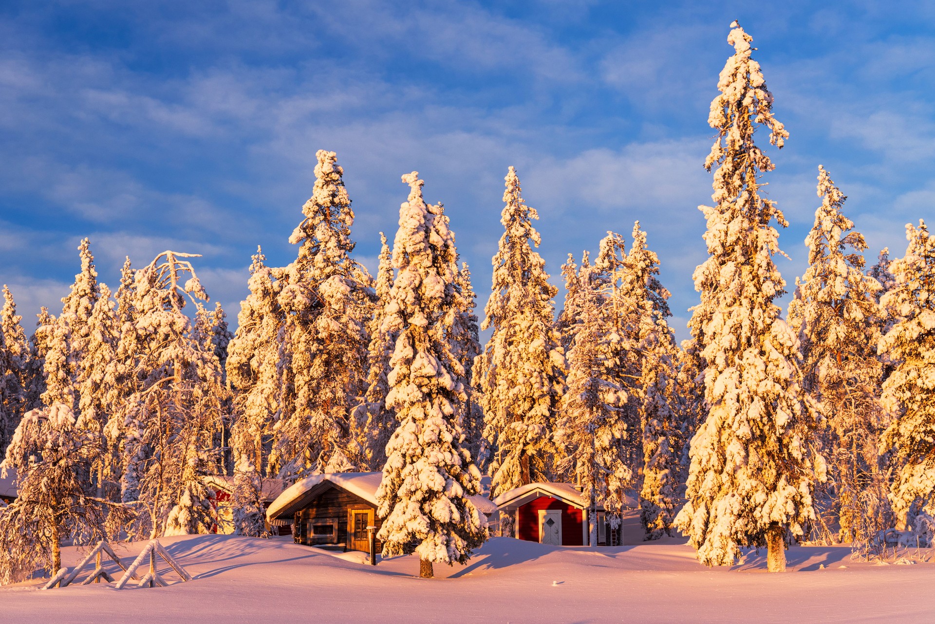 Mountains huts covered with snow in the frozen arctic landscape, Swedish Lapland, Sweden