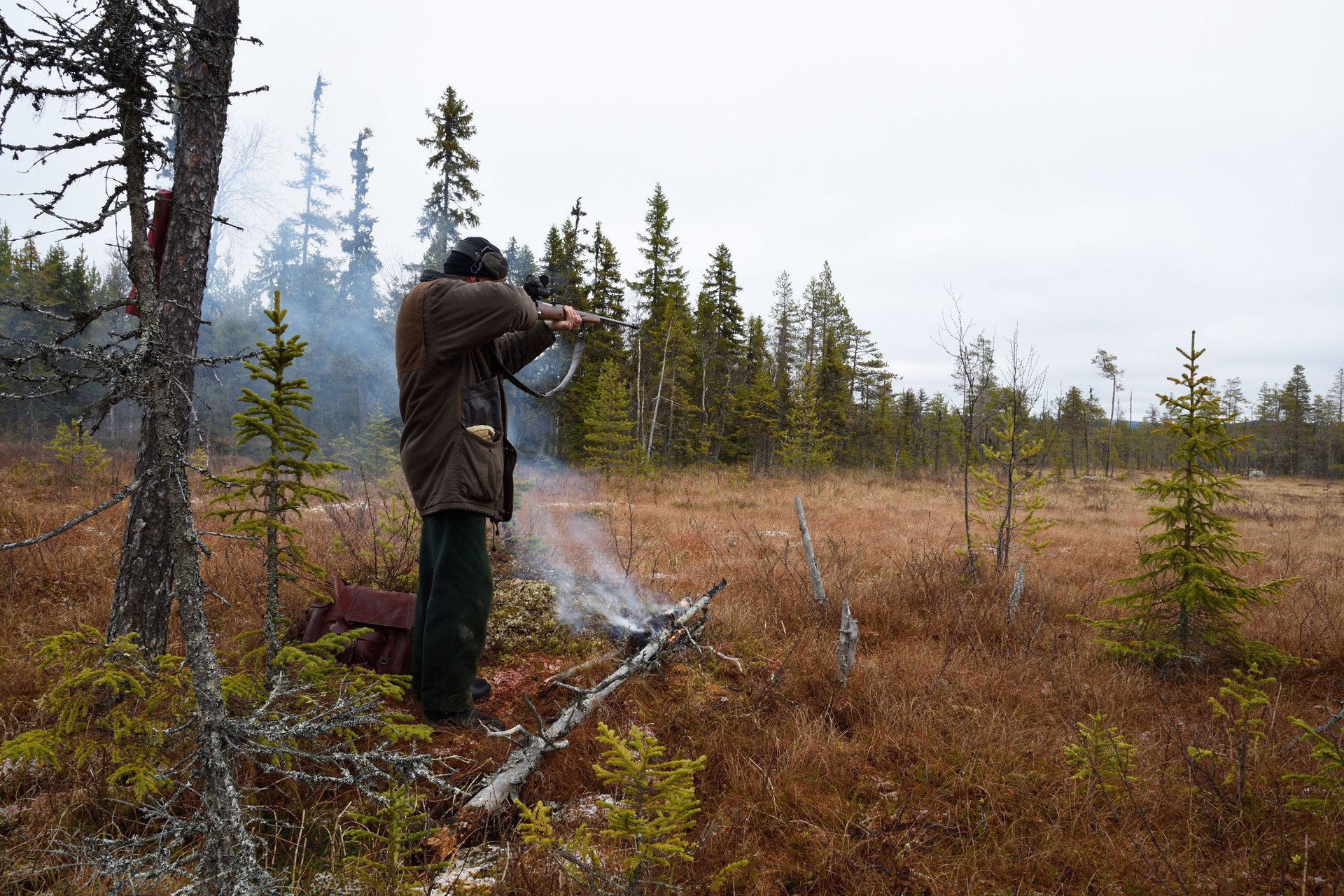 Hunter standing and aiming